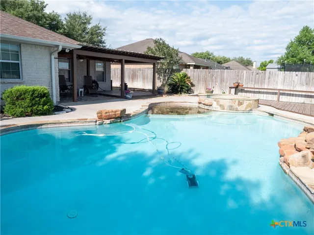 a front view of house with yard and outdoor seating