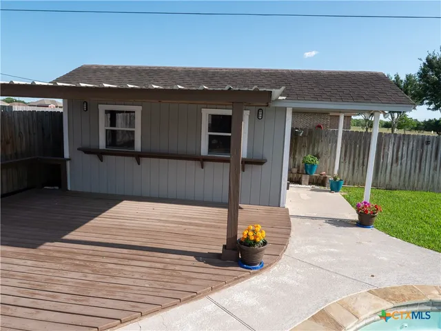 a view of a backyard with a small pool
