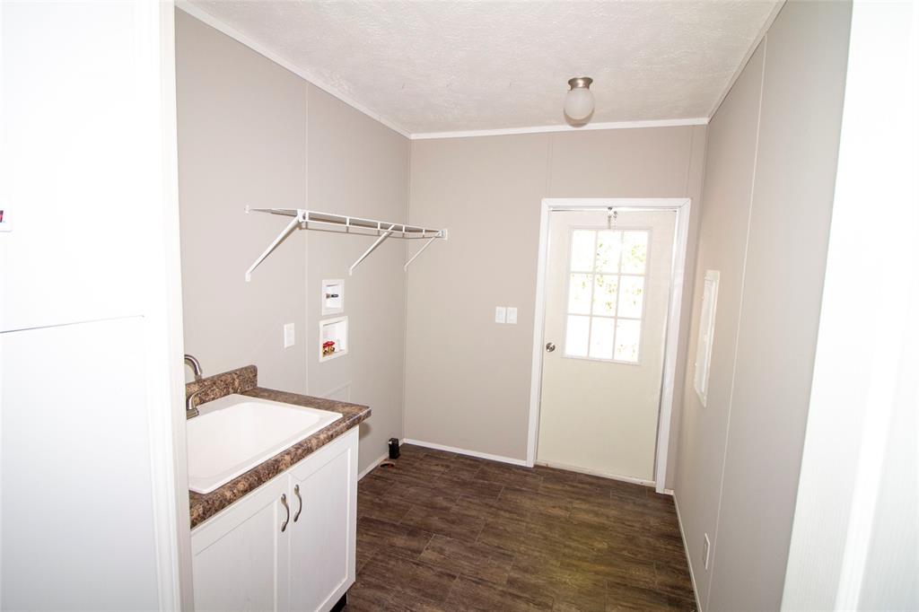 7572 Quitman Highway Quitman, LA 71268 - Photo 9 of 10 a bathroom with a granite countertop sink and a mirror