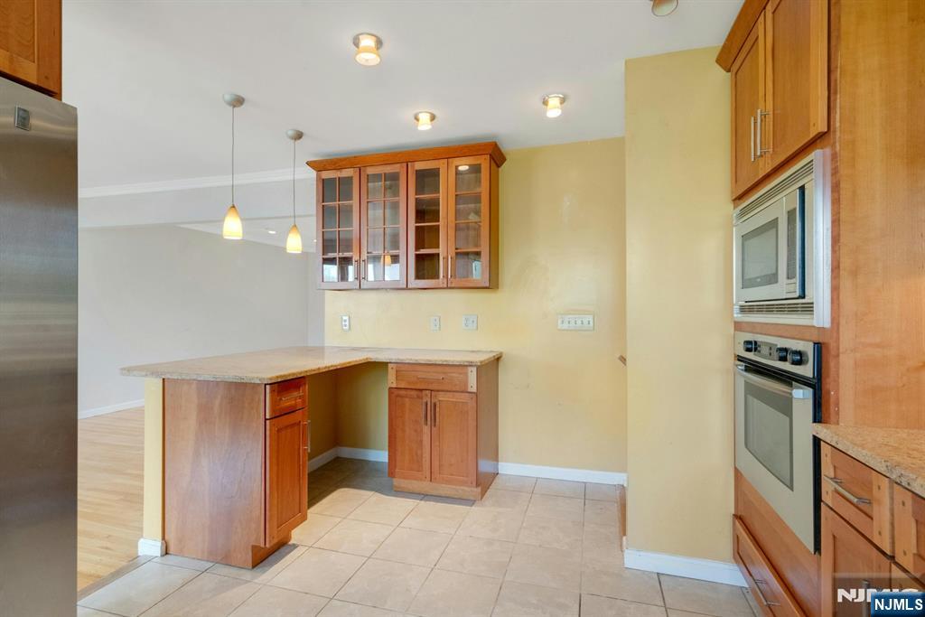 9 Hemlock Drive Paramus, NJ 07652 - Photo 18 of 35 a kitchen with stainless steel appliances granite countertop a refrigerator and a sink