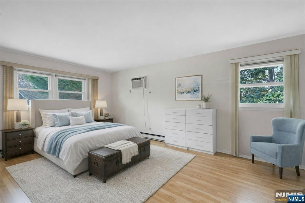 9 Hemlock Drive Paramus, NJ 07652 - Photo 20 of 35 a bedroom with a bed and a couch