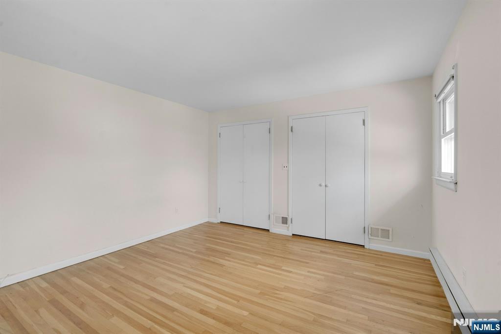 9 Hemlock Drive Paramus, NJ 07652 - Photo 25 of 35 a view of empty room with wooden floor