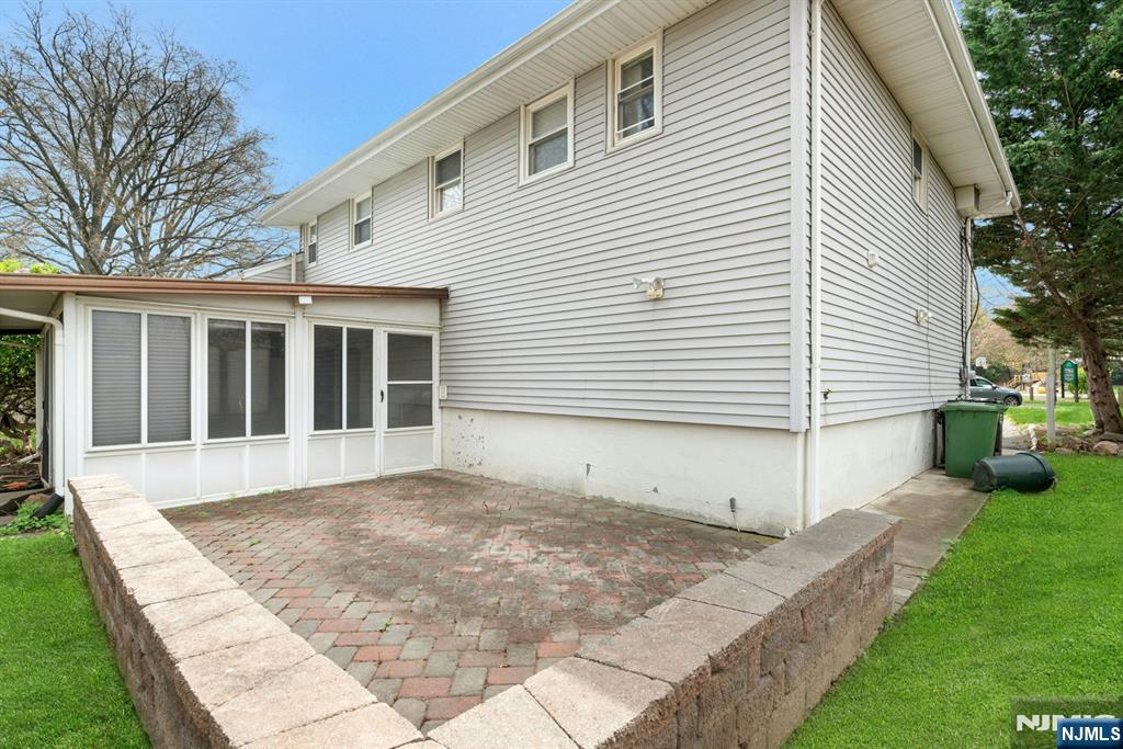 9 Hemlock Drive Paramus, NJ 07652 - Photo 33 of 35 a view of a house with a yard and sitting area