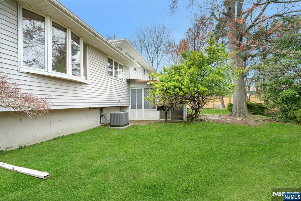 9 Hemlock Drive Paramus, NJ 07652 - Photo 35 of 35 a front view of a house with a garden
