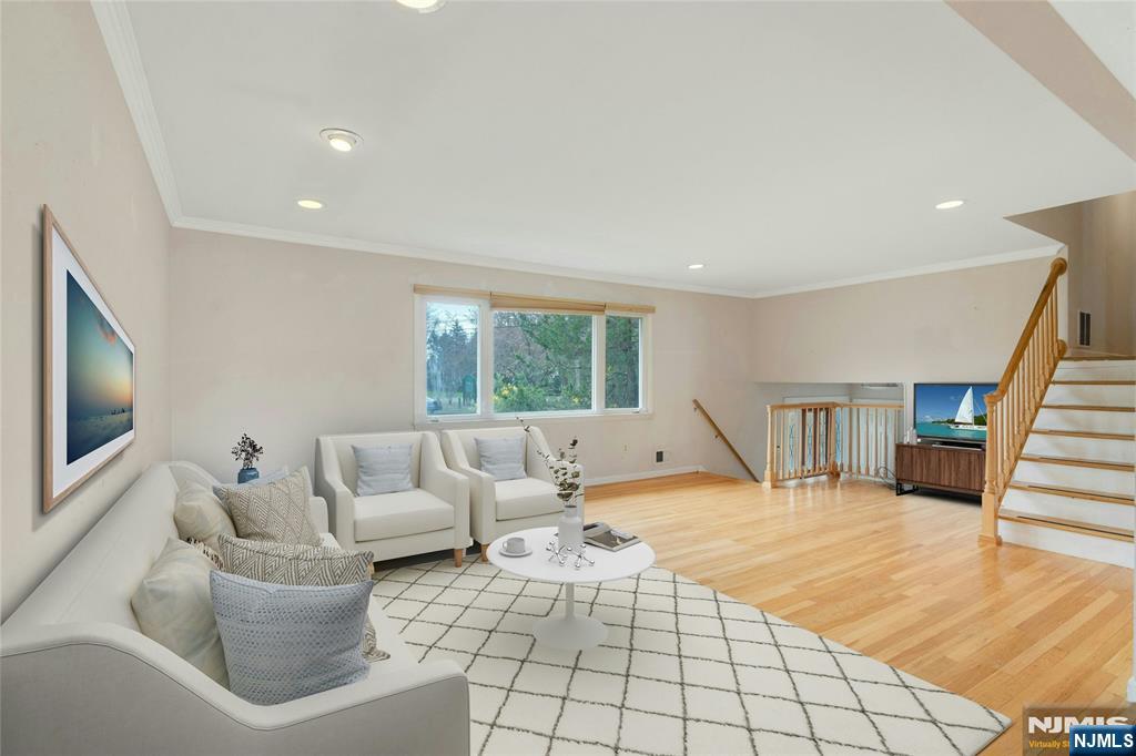 9 Hemlock Drive Paramus, NJ 07652 - Photo 5 of 35 a living room with furniture and a flat screen tv