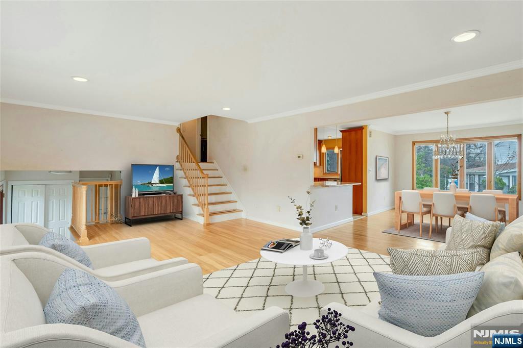 9 Hemlock Drive Paramus, NJ 07652 - Photo 8 of 35 a living room with furniture and wooden floor