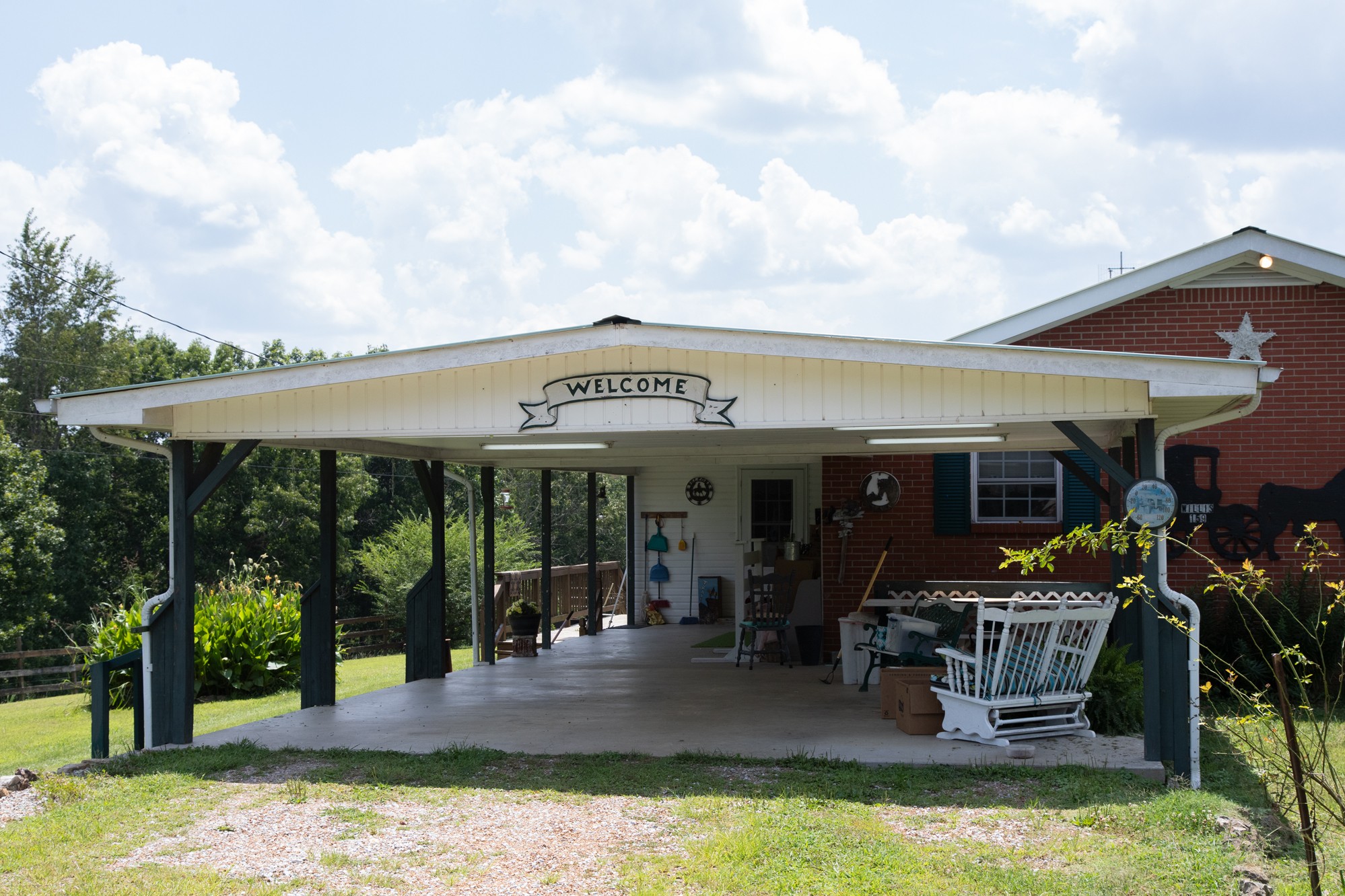 159 Trace Creek Road Hohenwald, TN 38462 - Photo 3 of 42 a view of a chairs and table in patio with a barbeque grill