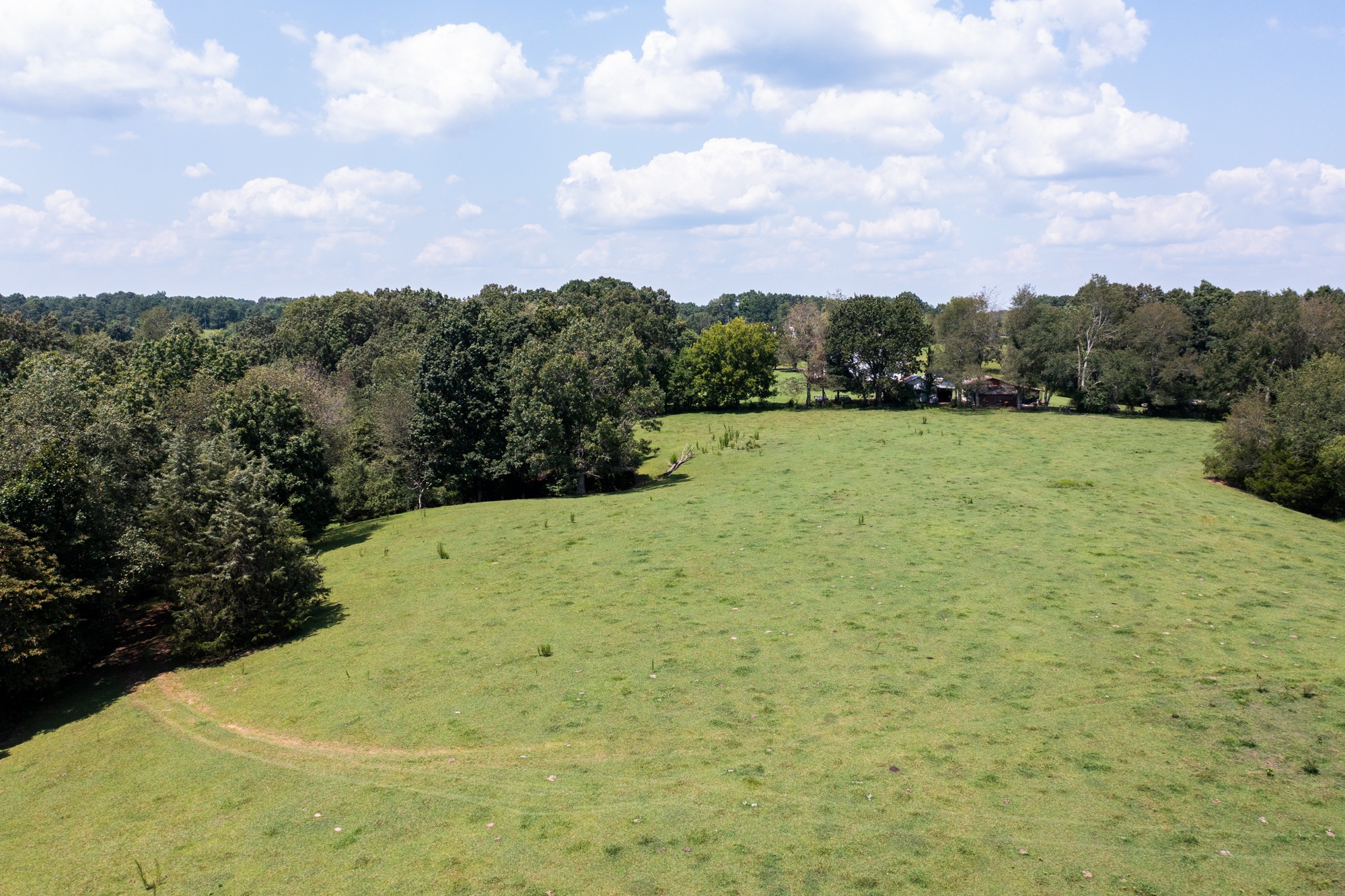 159 Trace Creek Road Hohenwald, TN 38462 - Photo 27 of 42 a view of a yard and mountain
