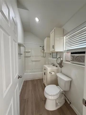 a view of a livingroom with wooden floor