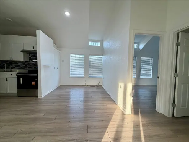 a view of a balcony with wooden floor