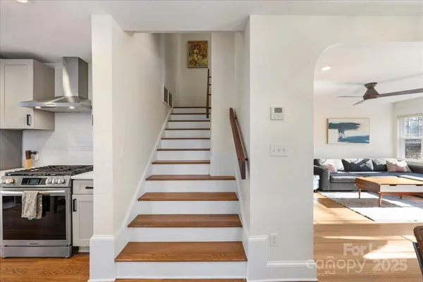a view of entryway and hall with wooden floor