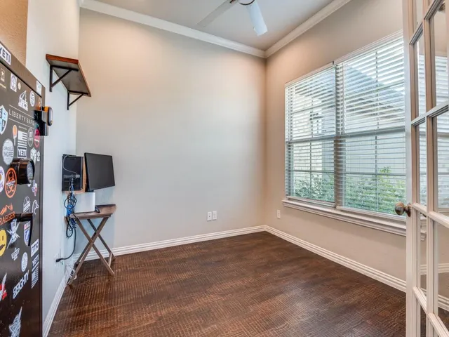 a view of room with workspace and windows