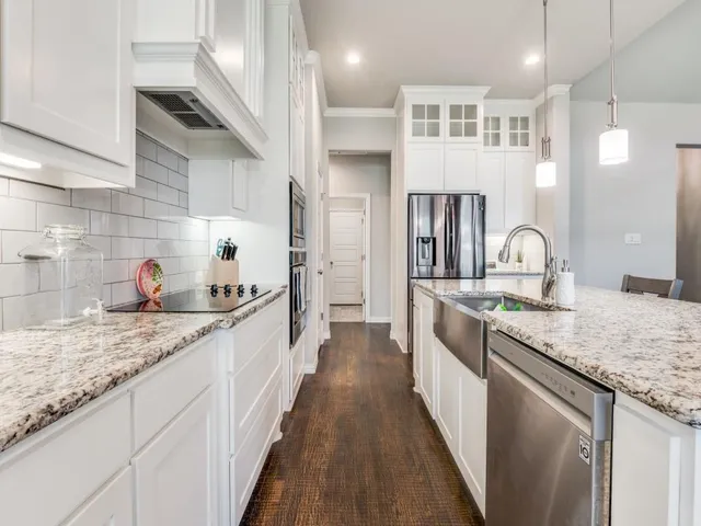 a kitchen with granite countertop lots of counter top space
