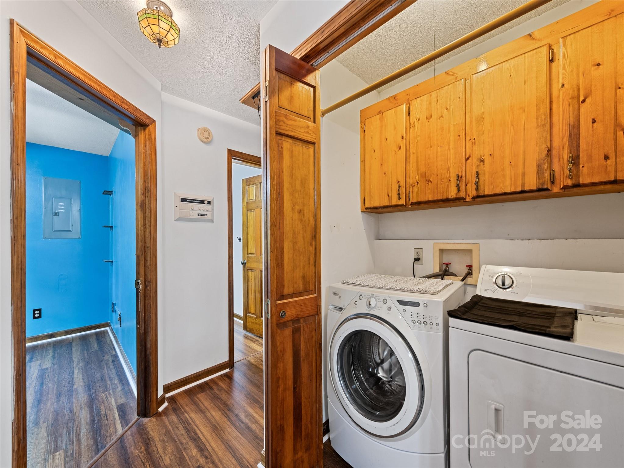 626 Rustic Heights Road Waynesville, NC 28785 - Photo 15 of 18 a utility room with wooden floor washer and dryer