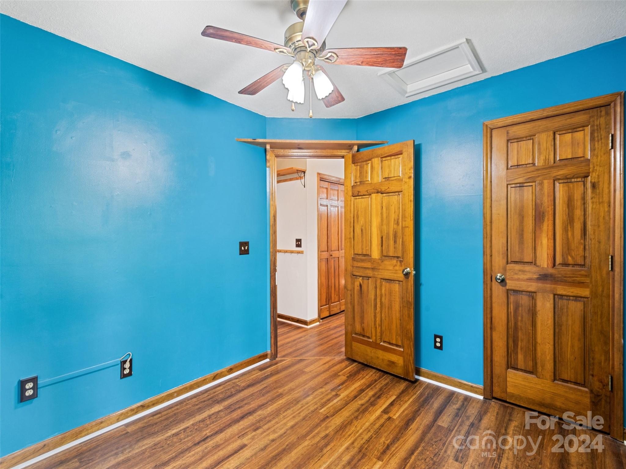 626 Rustic Heights Road Waynesville, NC 28785 - Photo 17 of 18 wooden floor in an empty room with a window
