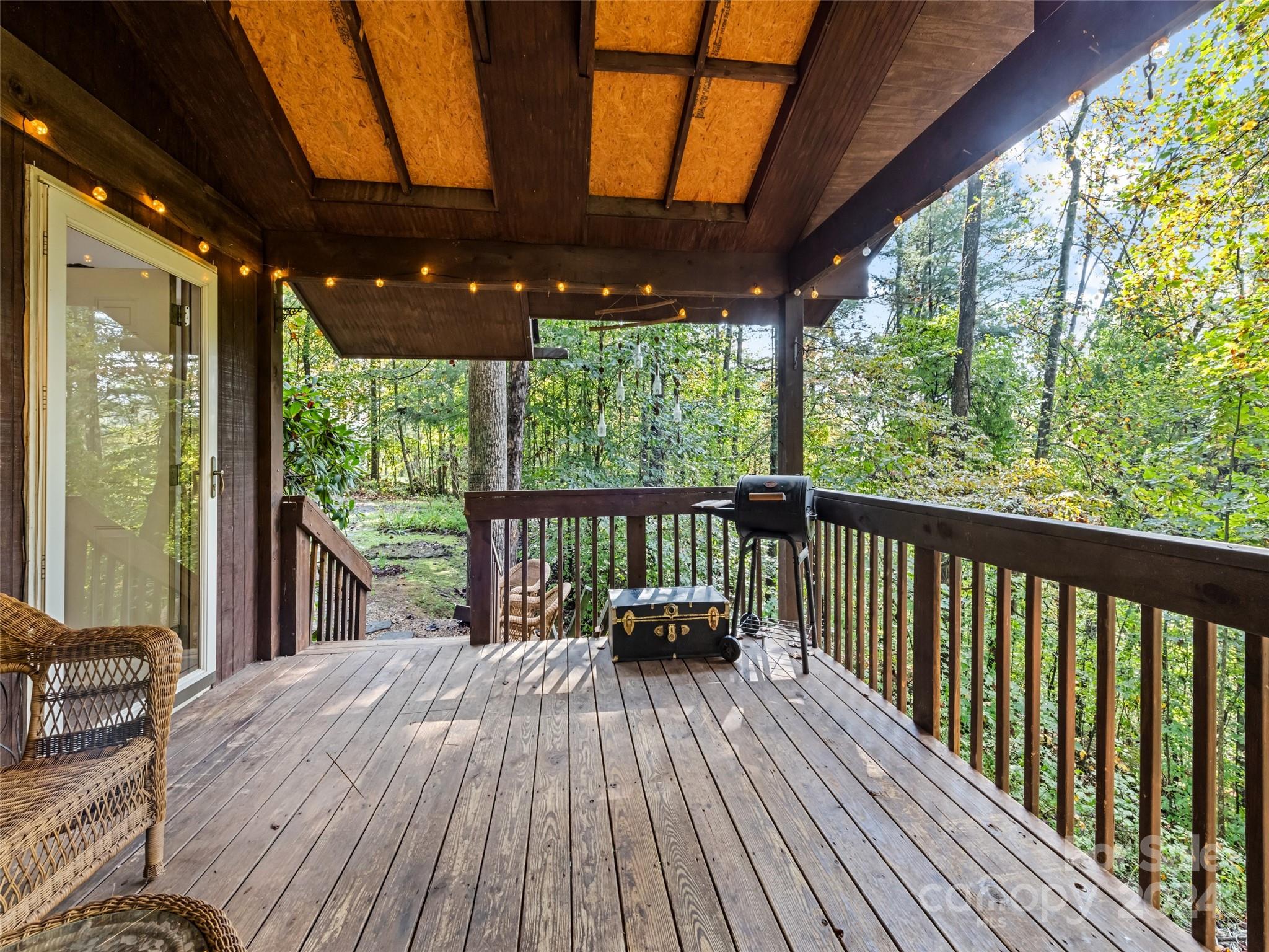 626 Rustic Heights Road Waynesville, NC 28785 - Photo 3 of 18 a view of a two chairs in the balcony