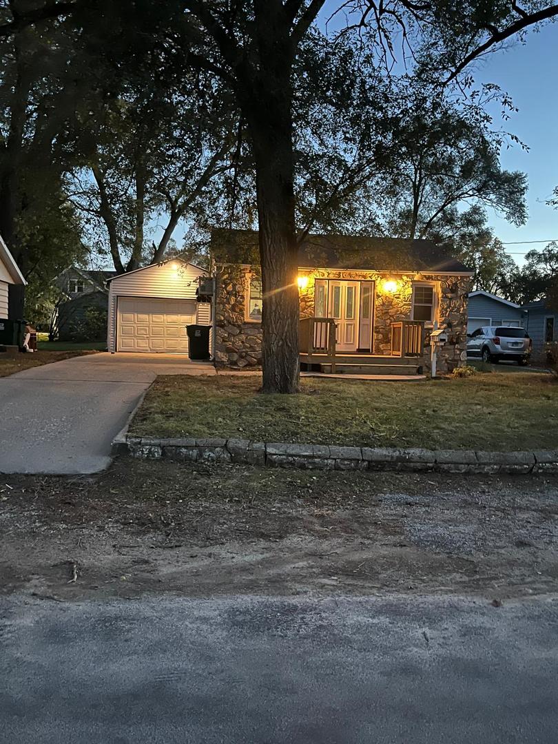 513 West 7th Street Rock Falls, IL 61071 - Photo 4 of 24 a view of a yard with plants and large trees