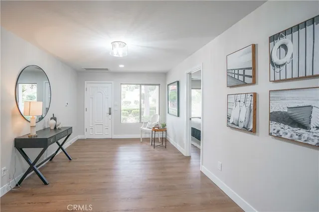 a view of a livingroom with furniture and wooden floor