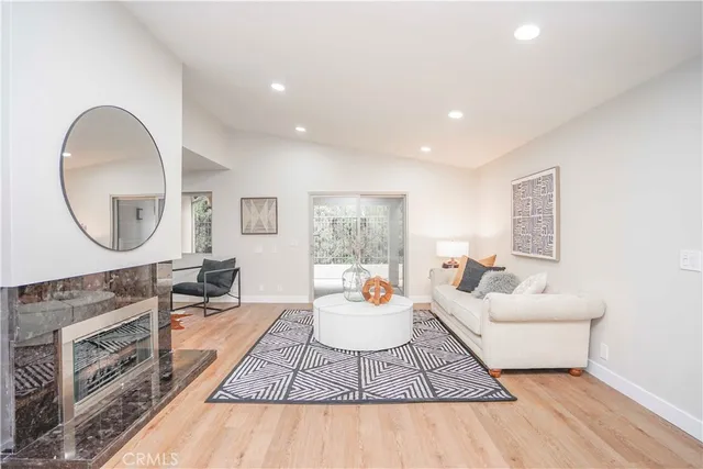 a living room with furniture and a rug