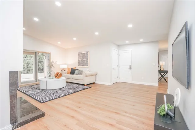 a dining room with furniture and wooden floor