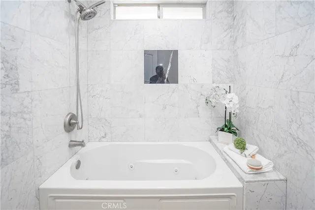 a living room with fireplace furniture and a wooden floor