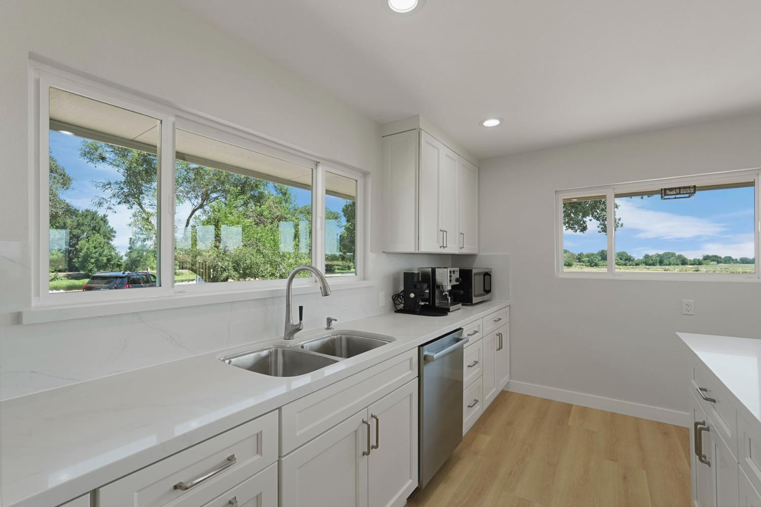 2650 West Twitchell Island Road Rio Vista, CA 94571 - Photo 32 of 60 a kitchen with a sink a window and cabinets