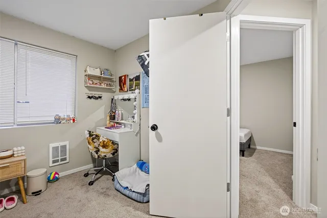 a bathroom with a granite countertop toilet a sink and a mirror