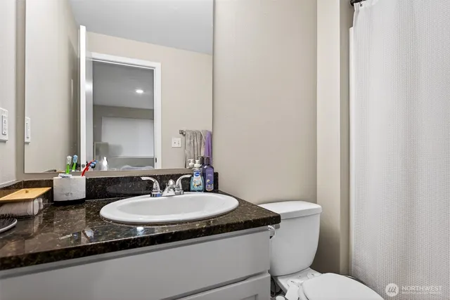 a view of a house with backyard sitting area and garden