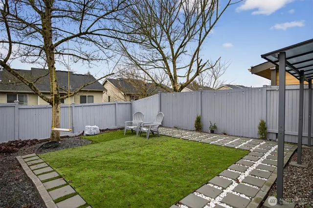 a table and chairs in front of a building