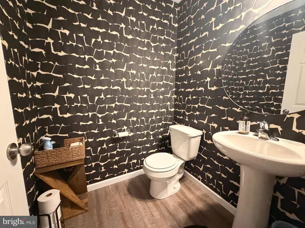 a bathroom with a toilet and a sink