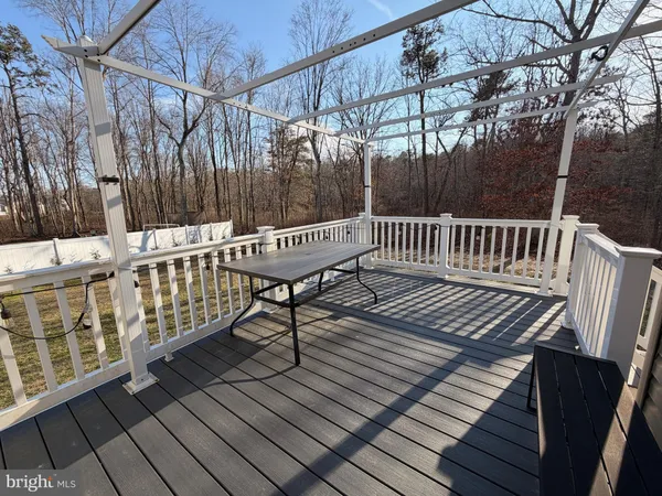 a view of a chairs on wooden deck