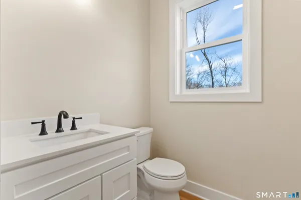 a bathroom with a toilet and a sink
