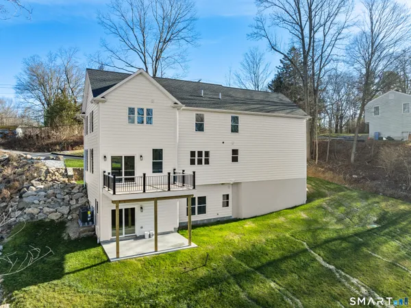 a view of house with backyard