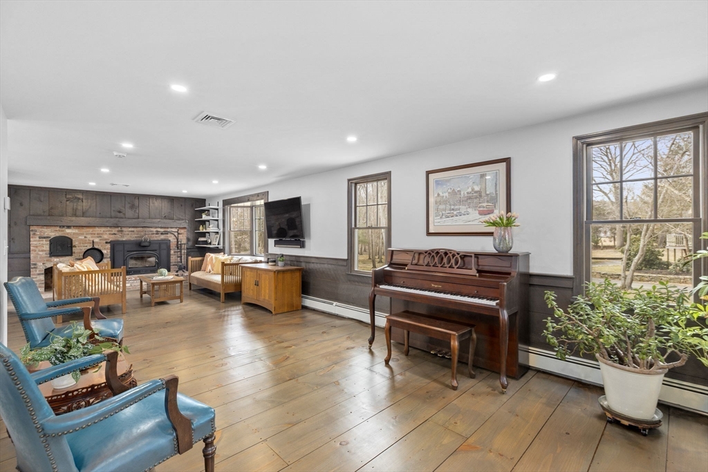 19 Kathy's Path Scituate, MA 02066 - Photo 12 of 41 a living room with furniture and a flat screen tv
