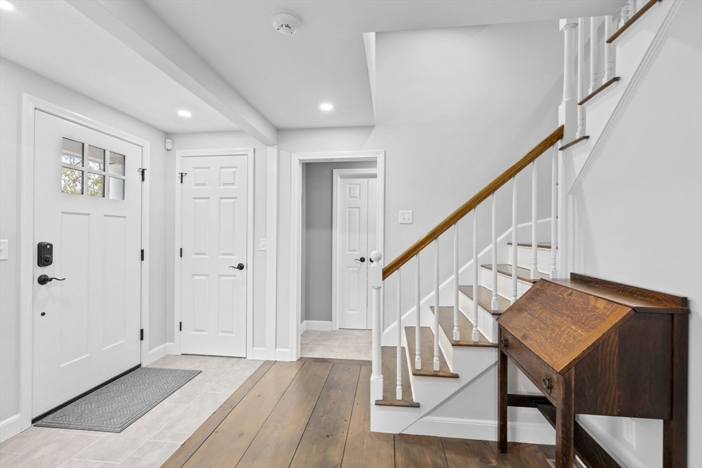 19 Kathy's Path Scituate, MA 02066 - Photo 18 of 41 a view of entryway with wooden floor and stairs