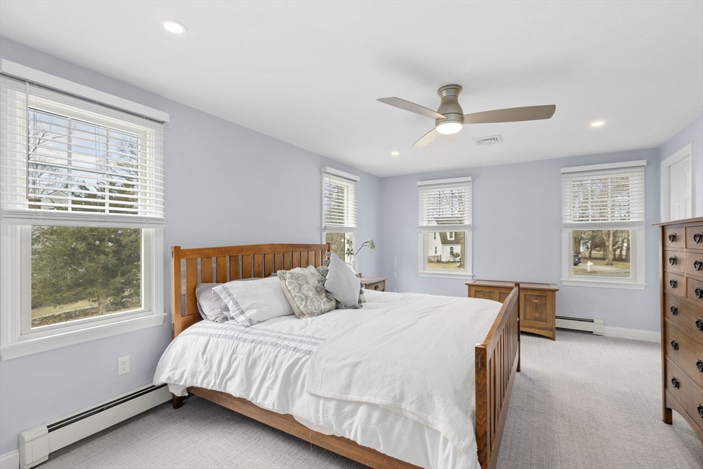 19 Kathy's Path Scituate, MA 02066 - Photo 19 of 41 a bedroom with a large bed and a window