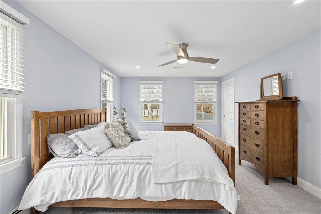 19 Kathy's Path Scituate, MA 02066 - Photo 20 of 41 a bedroom with a bed and wooden floor