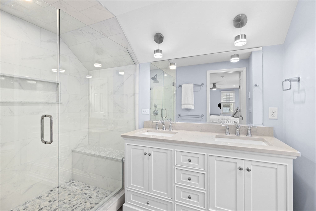 19 Kathy's Path Scituate, MA 02066 - Photo 21 of 41 a bathroom with a shower sink vanity granite and mirror