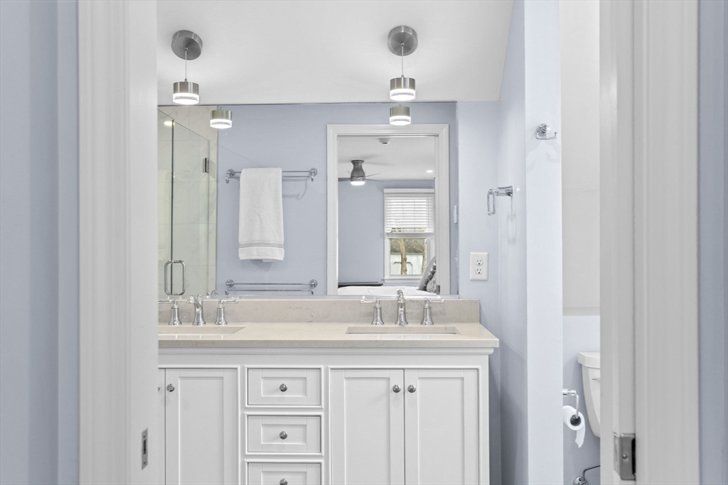 19 Kathy's Path Scituate, MA 02066 - Photo 22 of 41 a bathroom with a sink double vanity and a mirror