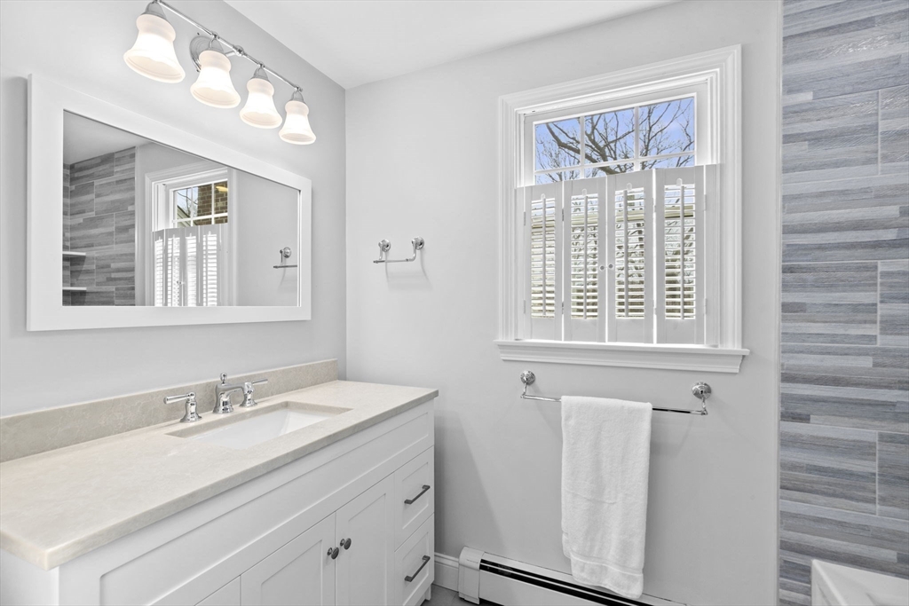 19 Kathy's Path Scituate, MA 02066 - Photo 26 of 41 a bathroom with a sink a vanity and a mirror
