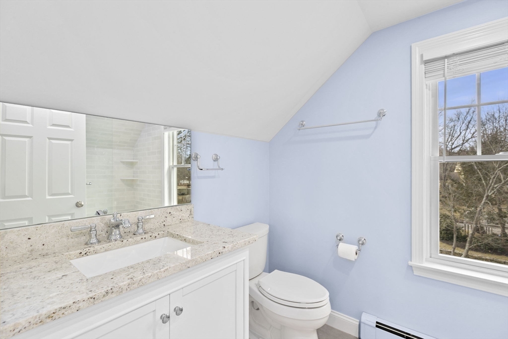 19 Kathy's Path Scituate, MA 02066 - Photo 32 of 41 a bathroom with a granite countertop sink a toilet and a mirror