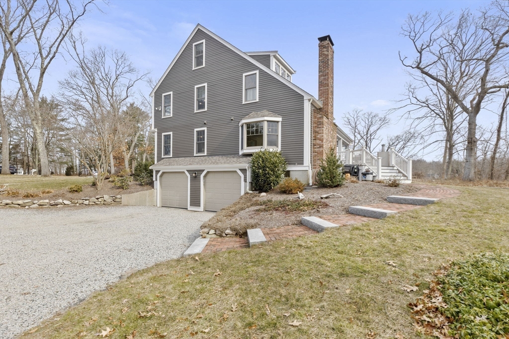 19 Kathy's Path Scituate, MA 02066 - Photo 35 of 41 a front view of a house with a yard covered in snow