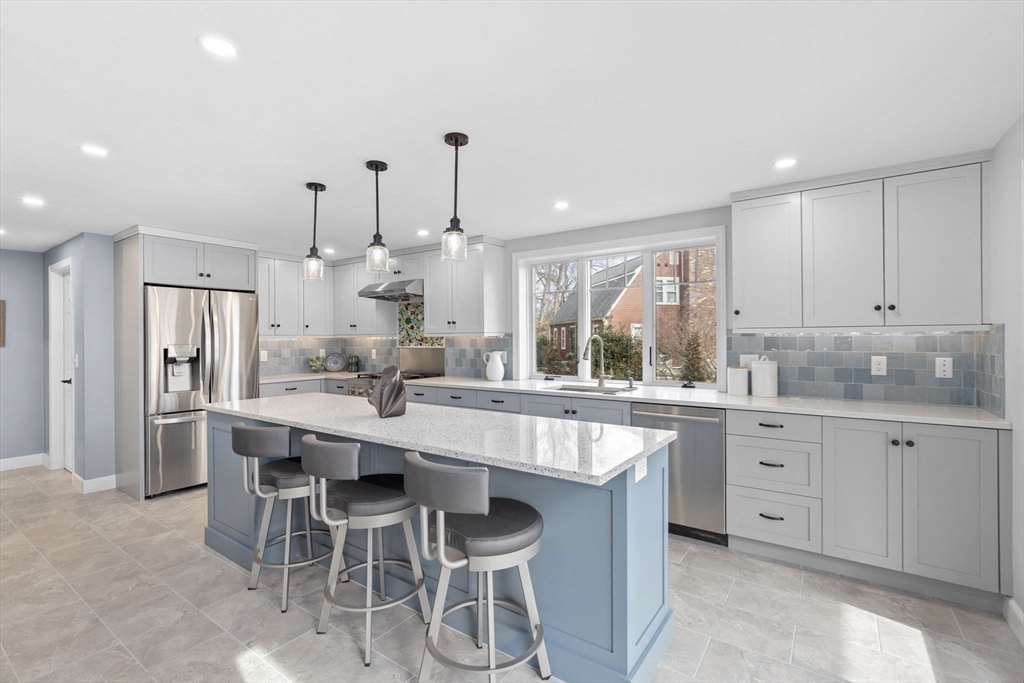 19 Kathy's Path Scituate, MA 02066 - Photo 4 of 41 a large kitchen with kitchen island a sink table and chairs