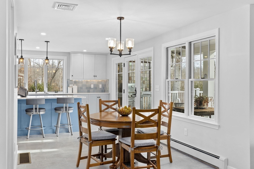 19 Kathy's Path Scituate, MA 02066 - Photo 9 of 41 a dining room with furniture a chandelier and kitchen view