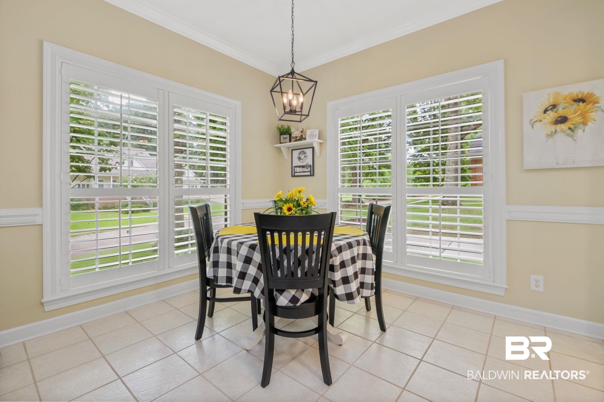 105 Beaver Dam Road Fairhope, AL 36532 - Photo 13 of 55 Tiled dining room featuring crown molding and an inviting chandelier