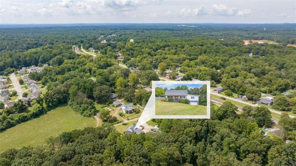 131 Caudell Drive Lula, GA 30554 - Photo 14 of 58 an aerial view of a residential houses with city view