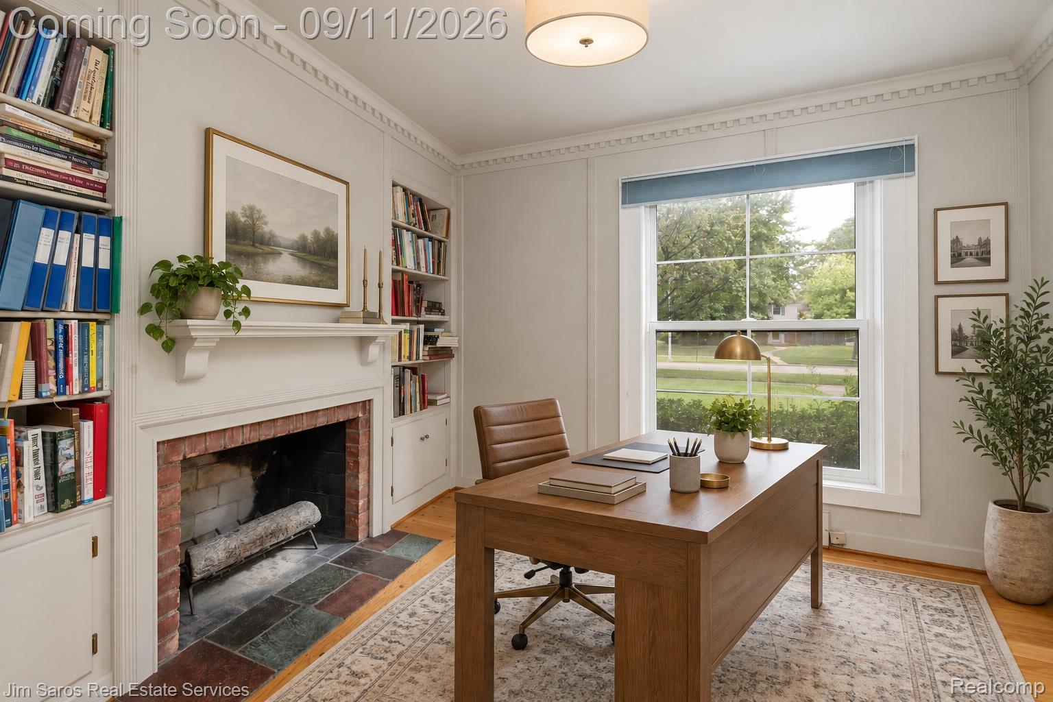 1445 Devonshire Road Grosse Pointe, MI 48230 - Photo 10 of 30 Built-in shelving, decorative crown molding, a fireplace with a brick surround, and wood-finish flooring