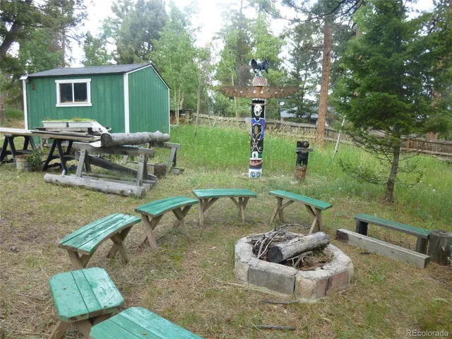 a view of a park with large trees