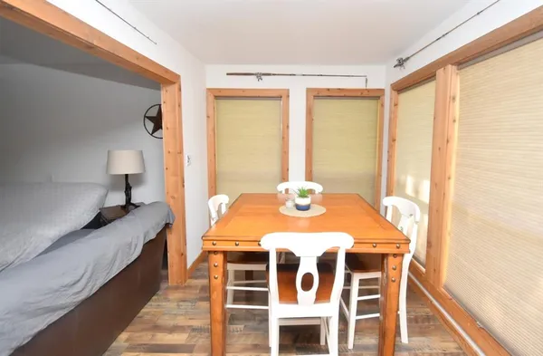 a dining room with a table and chairs