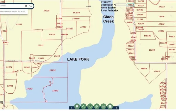 a picture of a wall with a small white building